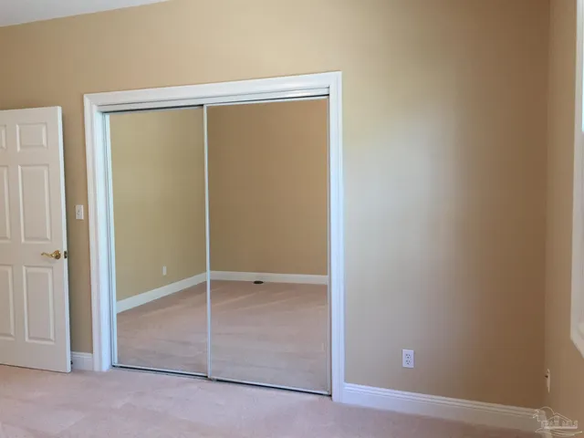 an empty room with sliding door