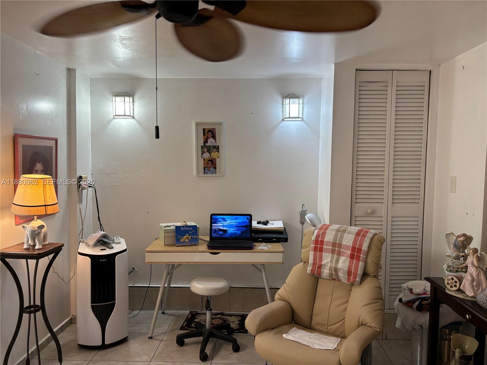 12343 Southwest 195th Terrace Miami, FL 33177 - Photo 17 of 45 a living room with furniture and a mirror