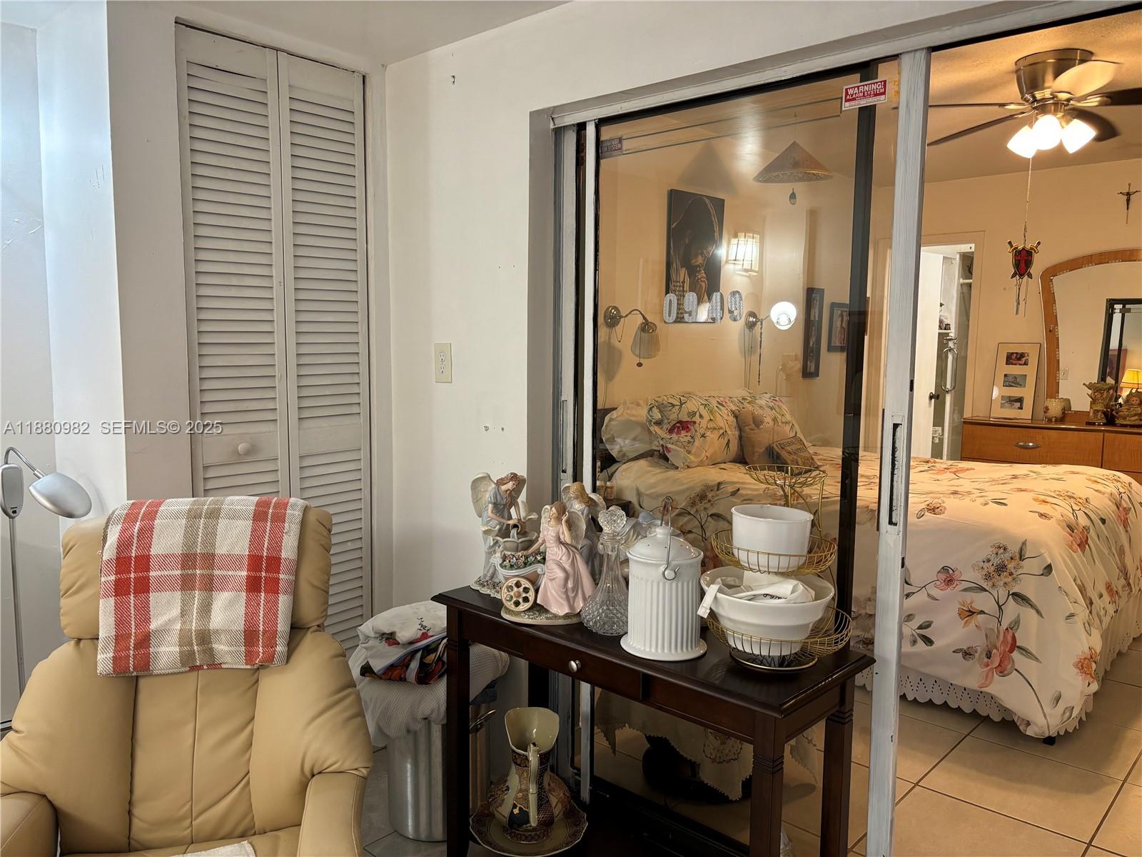 12343 Southwest 195th Terrace Miami, FL 33177 - Photo 19 of 45 a living room with furniture and a window