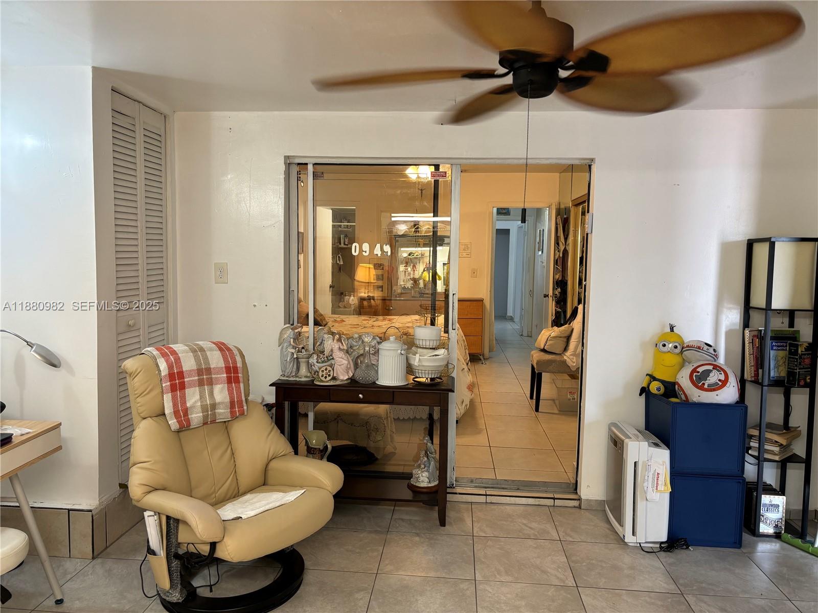 12343 Southwest 195th Terrace Miami, FL 33177 - Photo 20 of 45 a living room with patio furniture and a chandelier