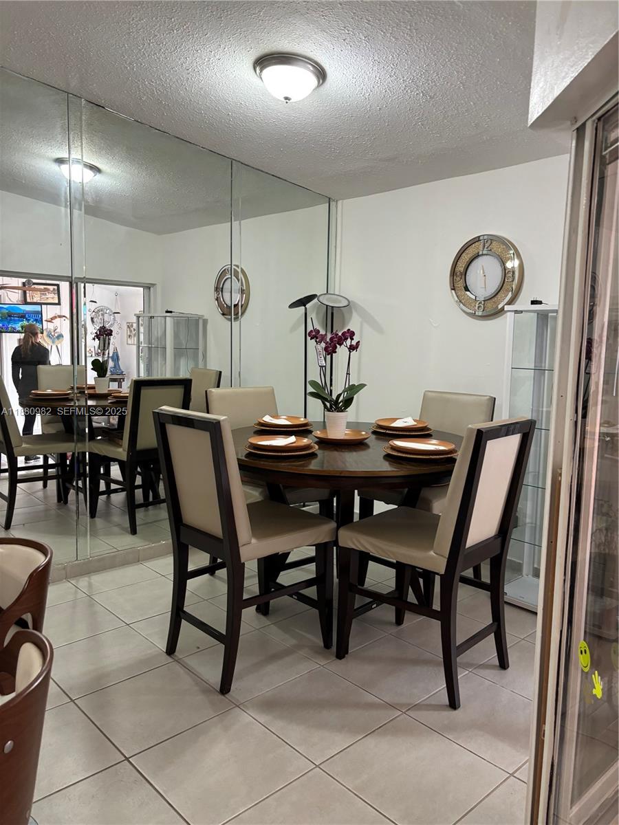 12343 Southwest 195th Terrace Miami, FL 33177 - Photo 32 of 45 a view of a dining room with furniture