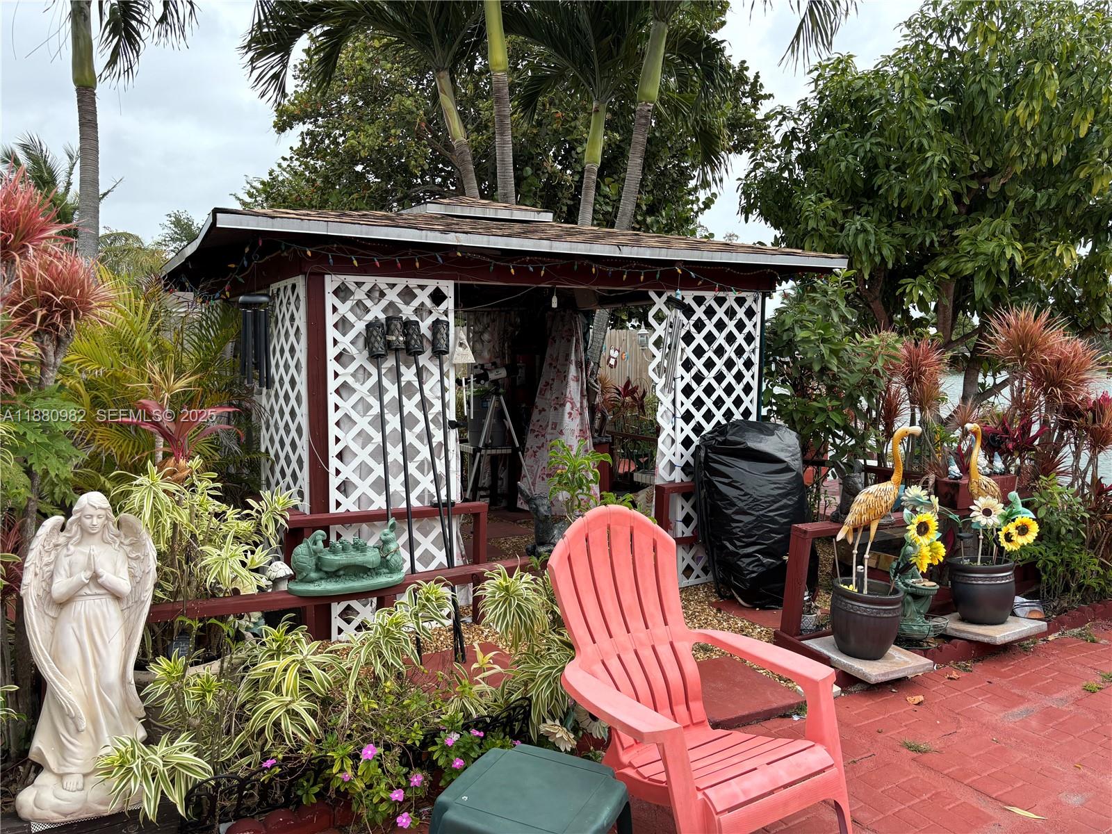 12343 Southwest 195th Terrace Miami, FL 33177 - Photo 37 of 45 a view of a chairs and table in the patio