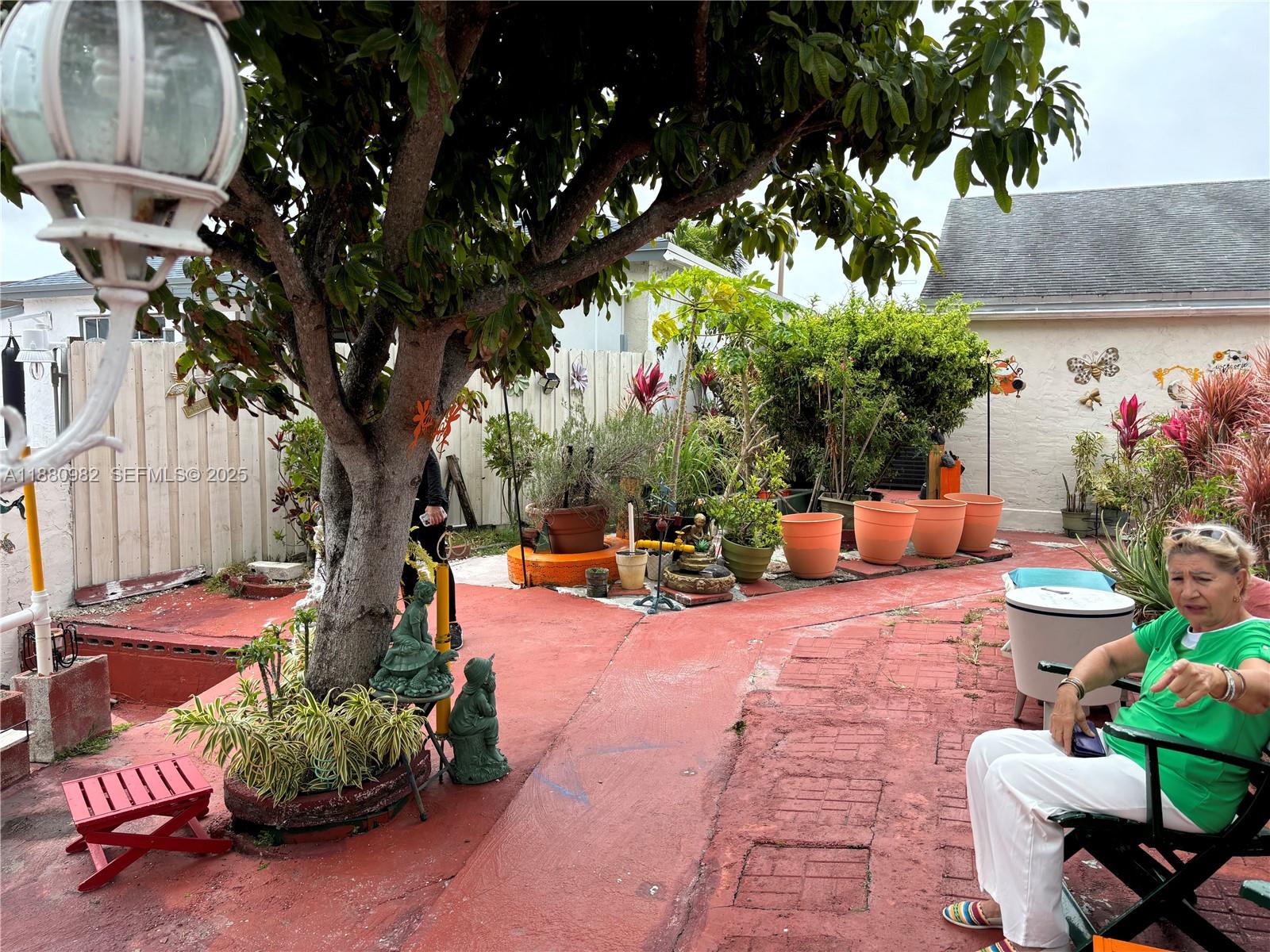 12343 Southwest 195th Terrace Miami, FL 33177 - Photo 42 of 45 a backyard of a house with seating space
