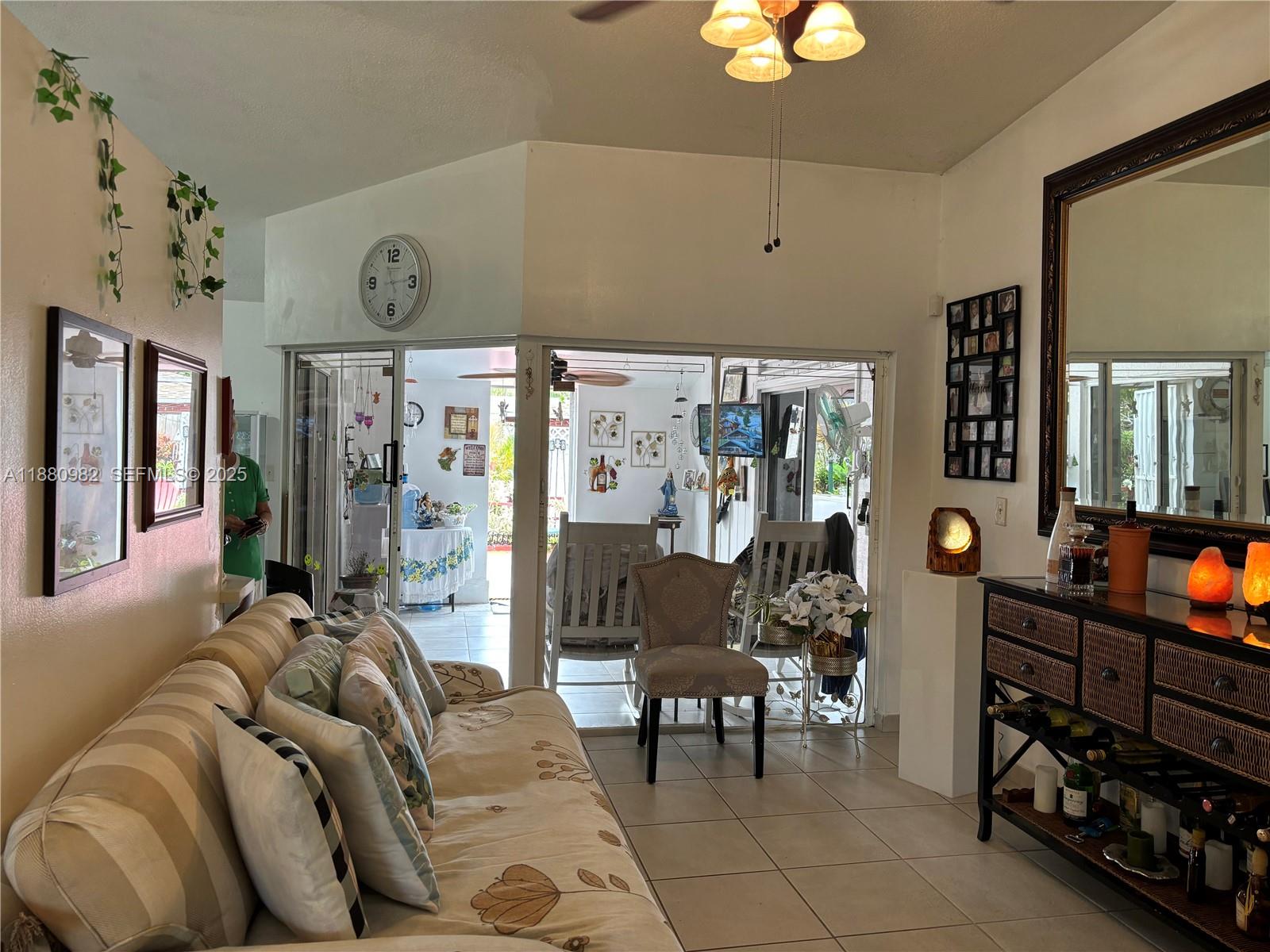 12343 Southwest 195th Terrace Miami, FL 33177 - Photo 8 of 45 a living room with furniture and a window