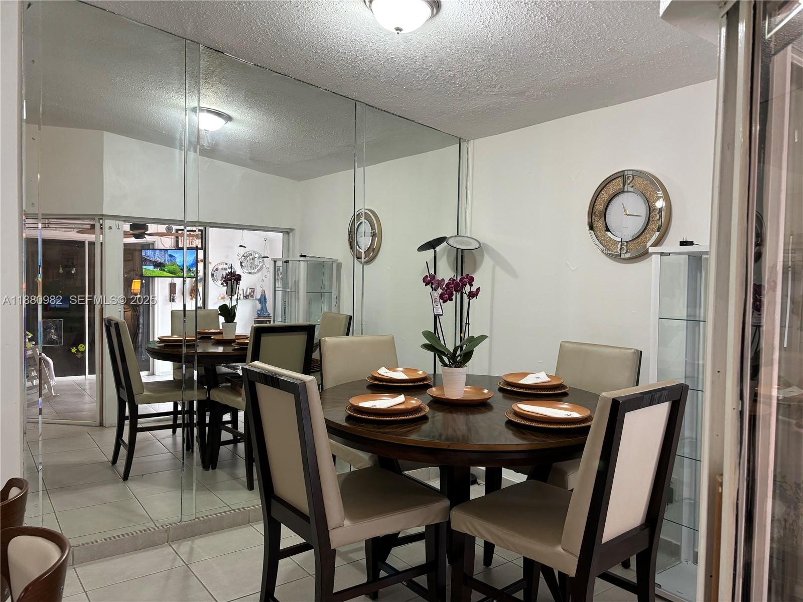12343 Southwest 195th Terrace Miami, FL 33177 - Photo 10 of 45 a view of a dining room and livingroom with furniture