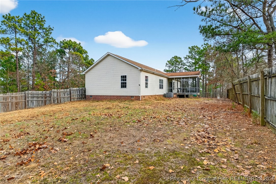 121 Prairie Lane Lillington, NC 27546 - Photo 28 of 40 a view of house with backyard and tree