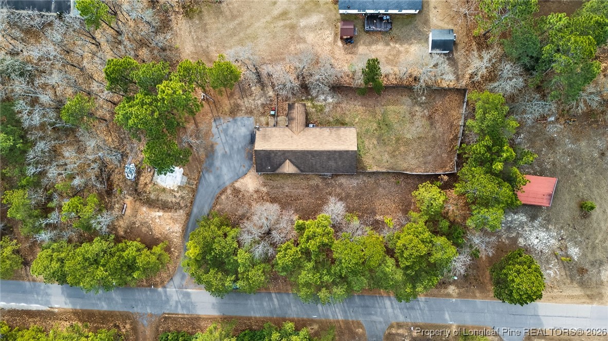 121 Prairie Lane Lillington, NC 27546 - Photo 31 of 40 an aerial view of a house with a yard and lake view