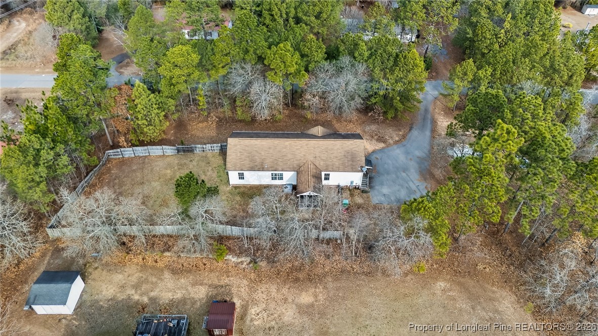 121 Prairie Lane Lillington, NC 27546 - Photo 36 of 40 an aerial view of a house with yard and outdoor seating