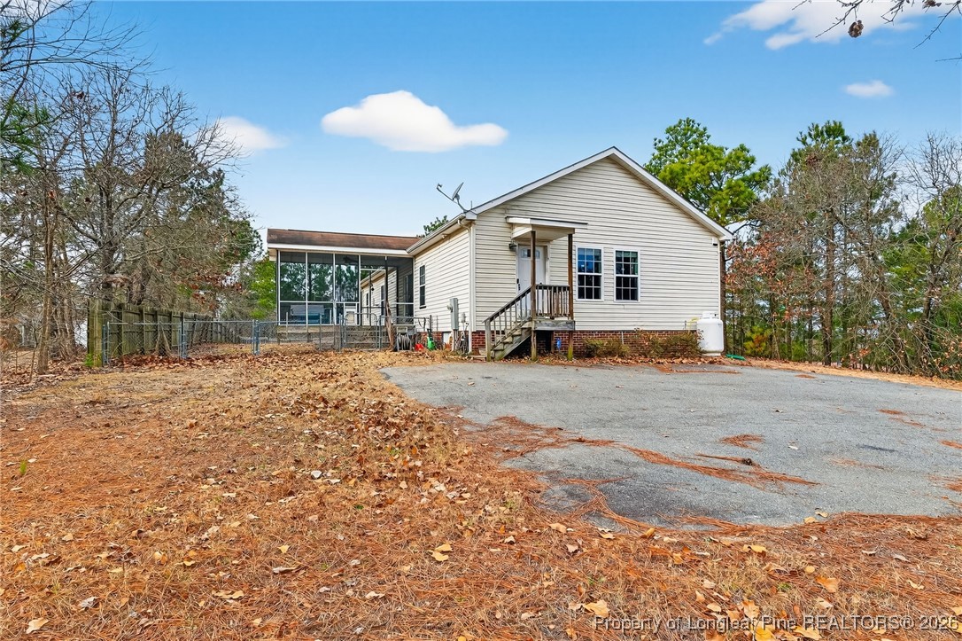 121 Prairie Lane Lillington, NC 27546 - Photo 40 of 40 a view of a house with a yard covered in snow