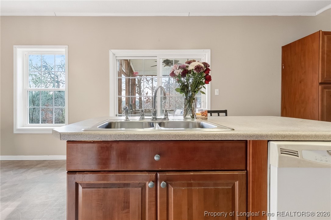 121 Prairie Lane Lillington, NC 27546 - Photo 5 of 40 a room with kitchen island a sink and a large mirror