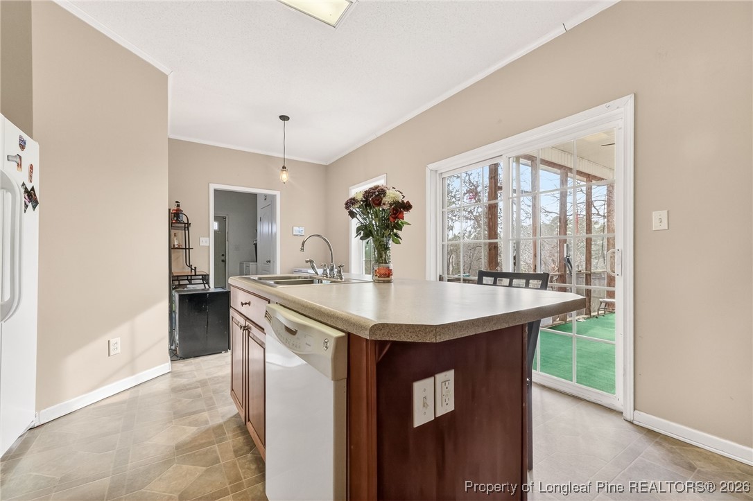 121 Prairie Lane Lillington, NC 27546 - Photo 7 of 40 a kitchen with a sink and cabinets