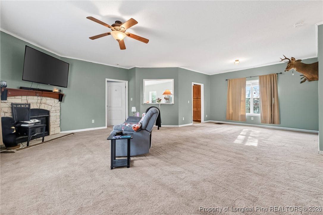 121 Prairie Lane Lillington, NC 27546 - Photo 8 of 40 a living room with furniture and a flat screen tv
