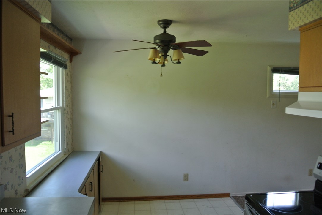4418-4422 Maplepark Road Stow, OH 44224 - Photo 15 of 32 Tiled dining room with plenty of natural light and ceiling fan