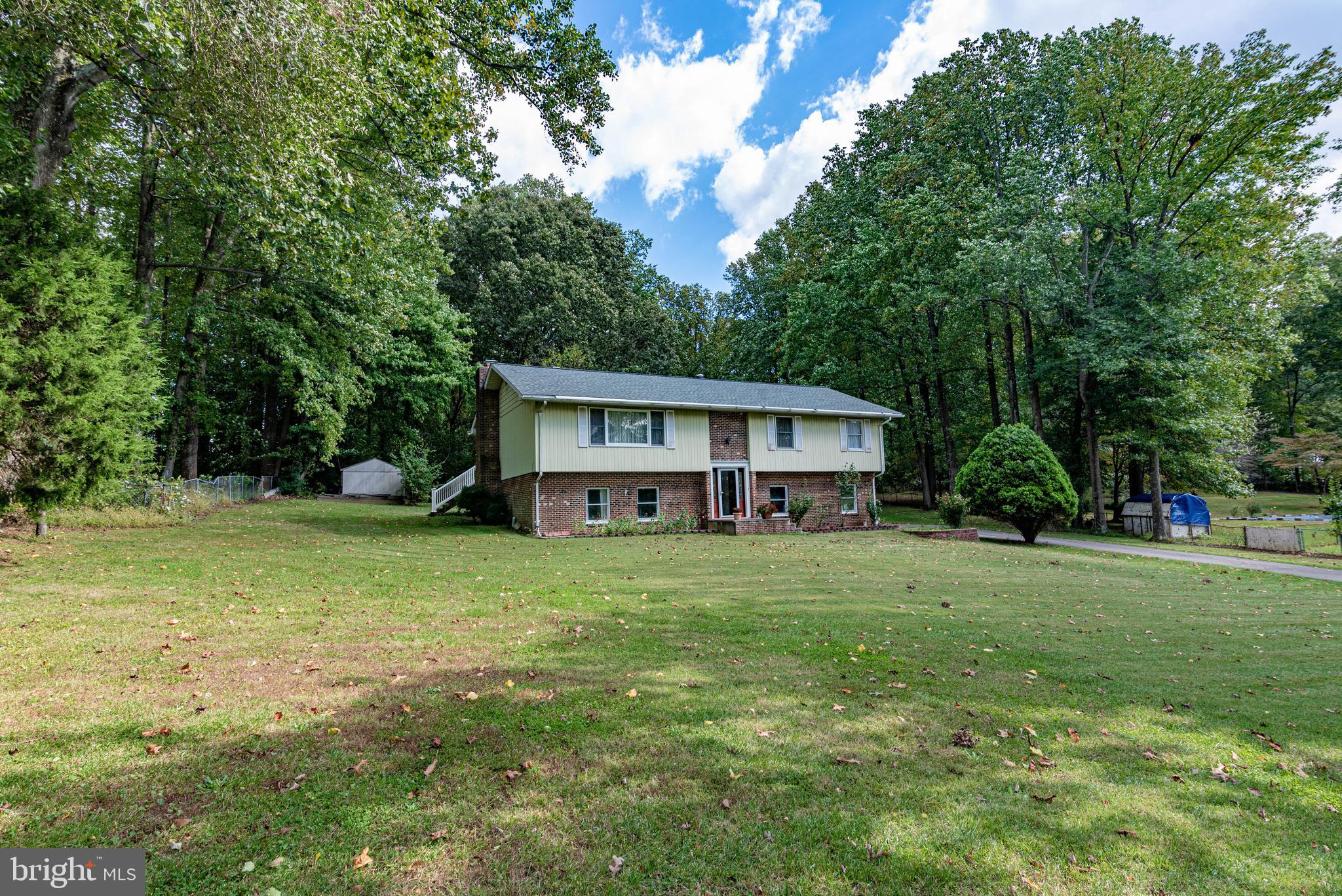9619 Boyds Turn Road Owings, MD 20736 - Photo 49 of 69 a front view of a house with a garden