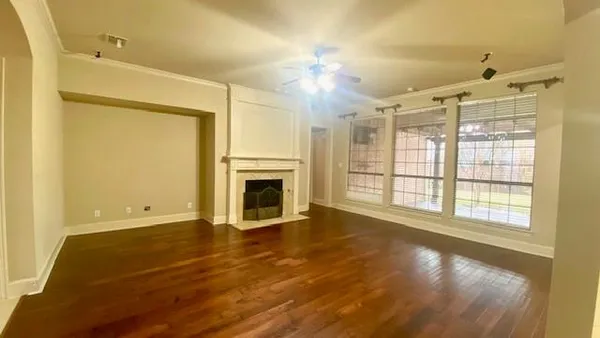 a bathroom with a bathtub shower sink vanity and toilet