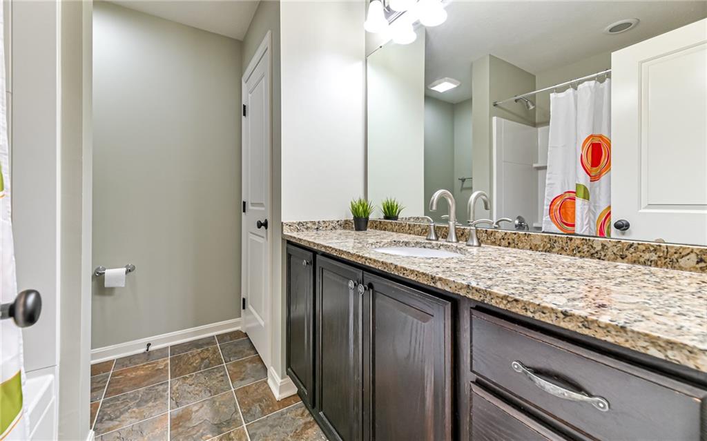 113 Shenot Road Wexford, PA 15090 - Photo 16 of 18 Hall bathroom with over sized vanity with granite top, linen closet and tub.