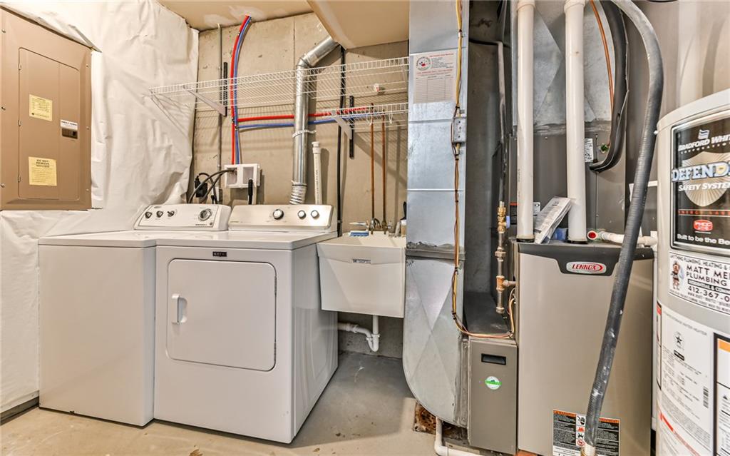 113 Shenot Road Wexford, PA 15090 - Photo 18 of 18 Lower level laundry includes washer, dryer and utility sink.