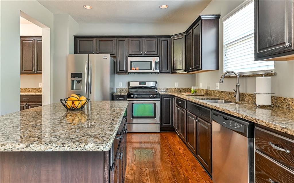 113 Shenot Road Wexford, PA 15090 - Photo 5 of 18 Kitchen boasts stainless steel appliances with center island and granite counter tops.