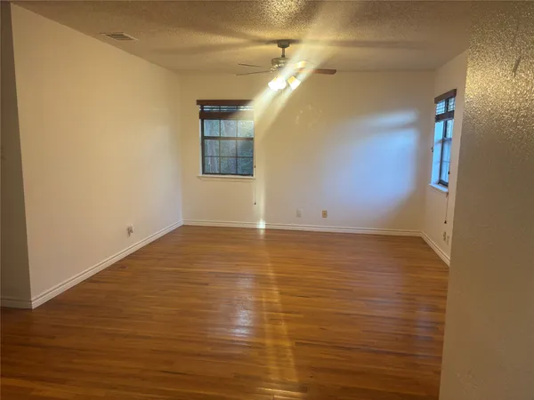 a view of a room with wooden floor and small space