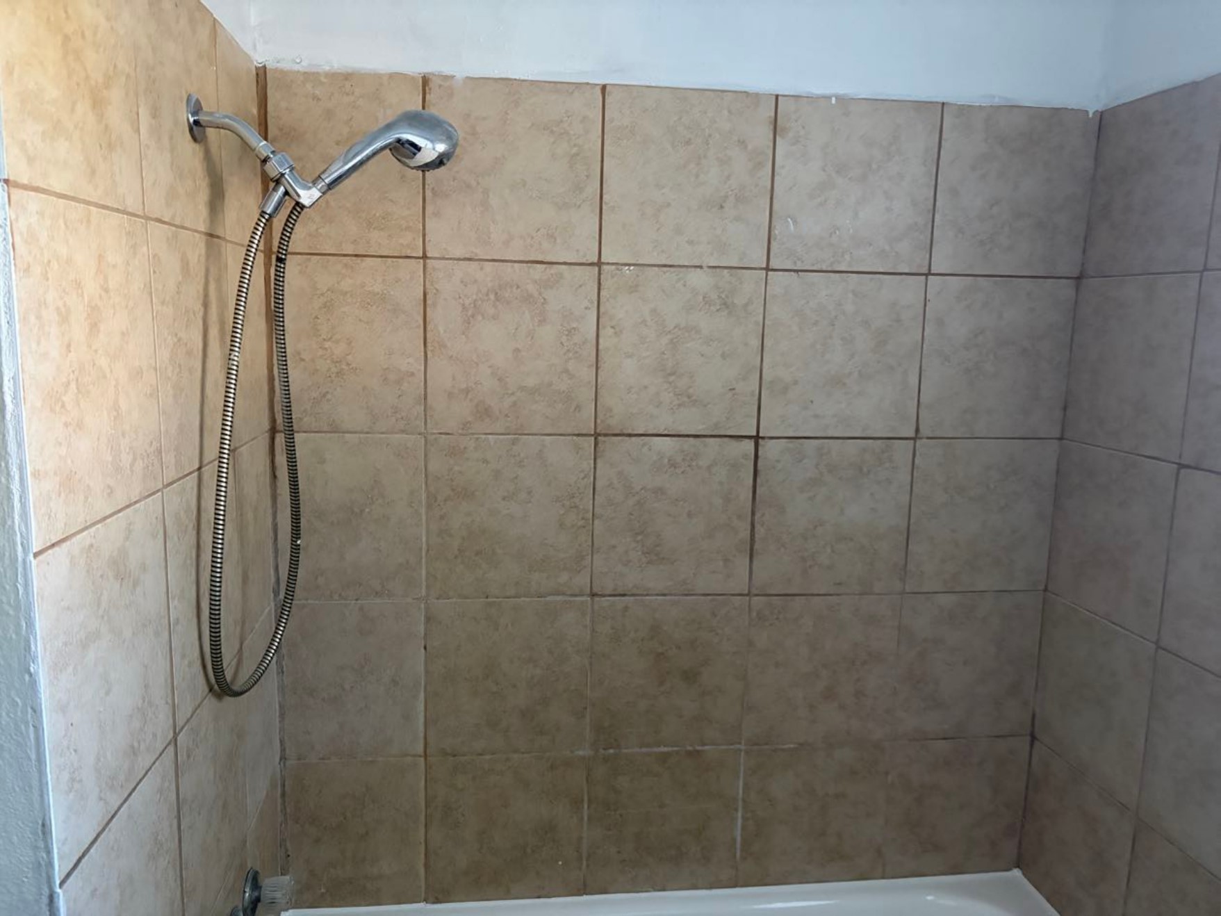 5782 Belcrest Street Houston, TX 77033 - Photo 16 of 18 a bathroom with a shower