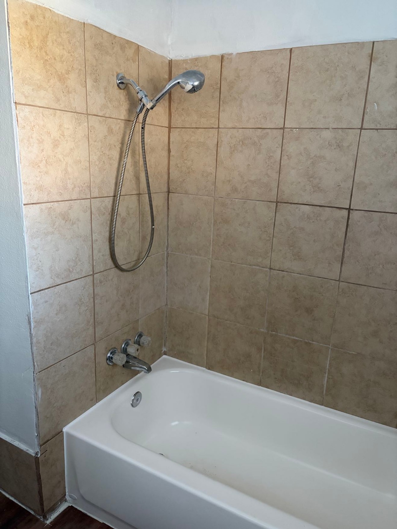 5782 Belcrest Street Houston, TX 77033 - Photo 18 of 18 a bathroom with a bath tub with a shower