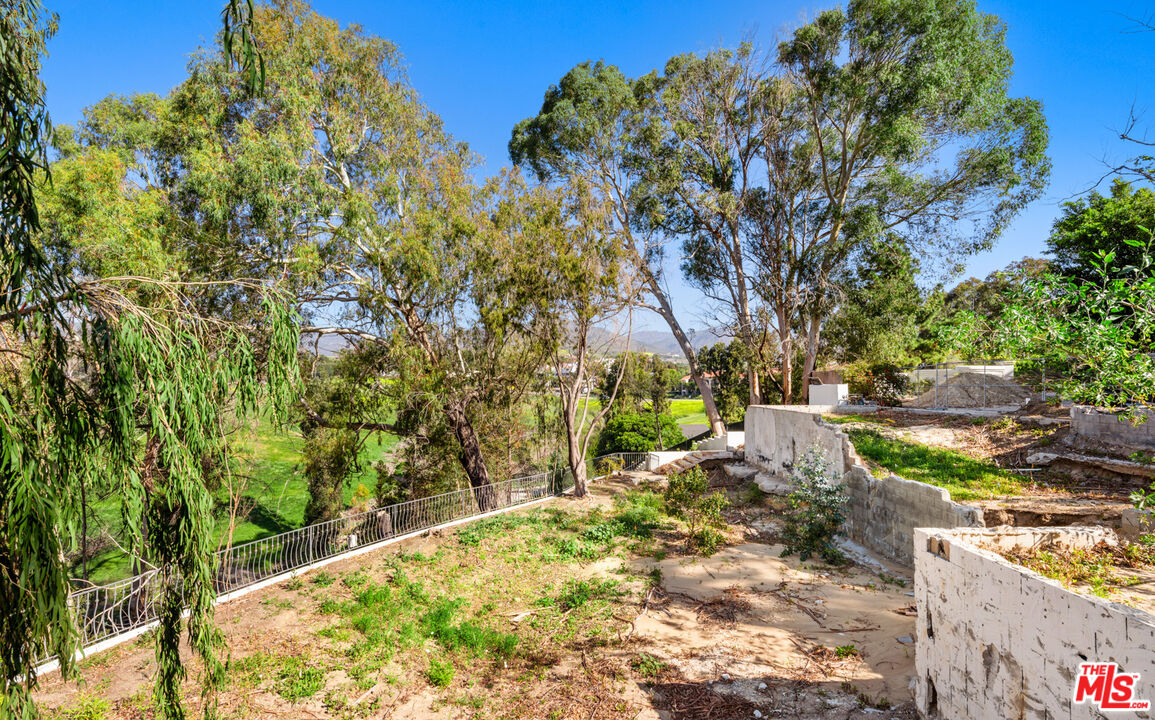 6611 Portshead Road Malibu, CA 90265 - Photo 16 of 19 a backyard of a house with lots of green space