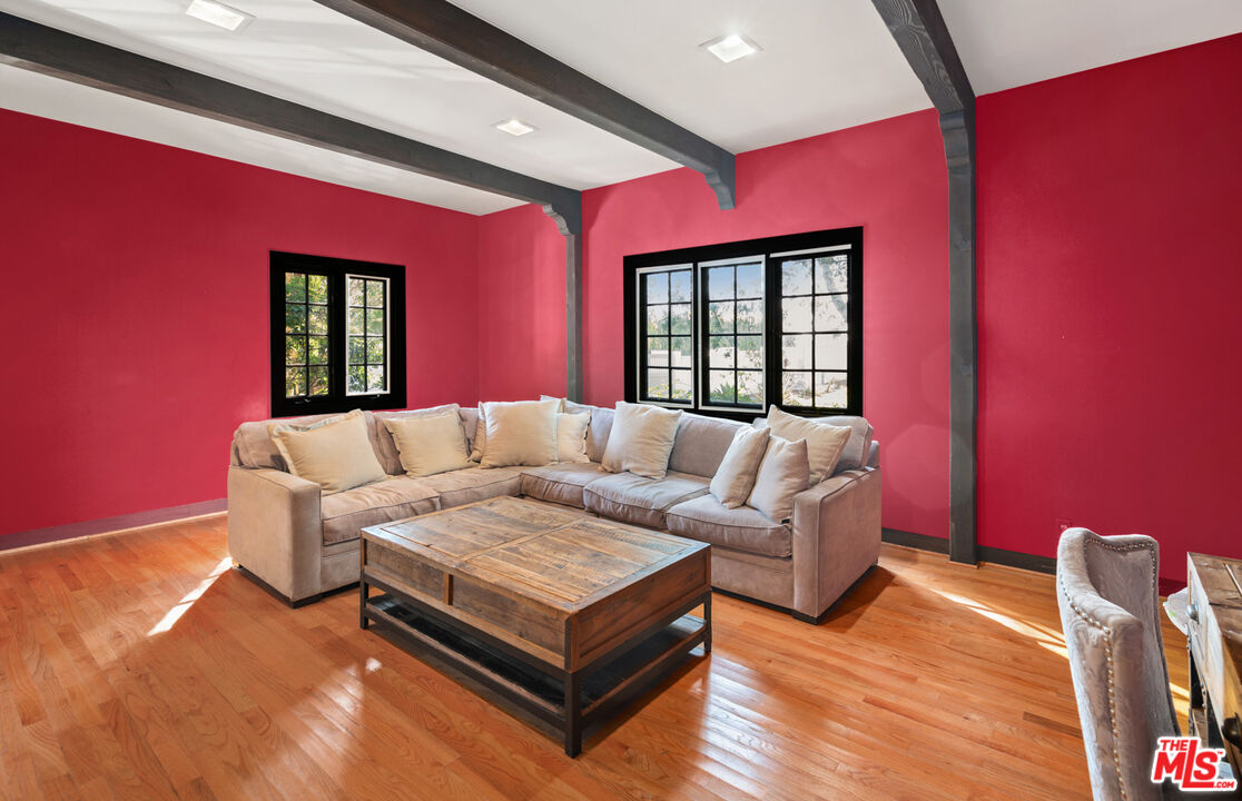 6611 Portshead Road Malibu, CA 90265 - Photo 7 of 19 a living room with furniture and a large window