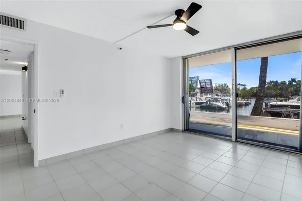 a bedroom with furniture and a flat screen tv