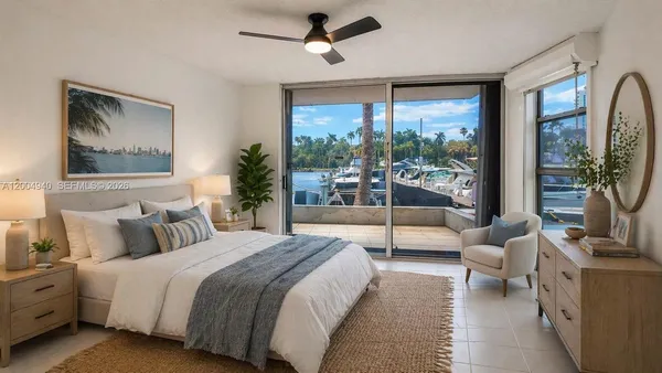 a spacious bedroom with a large bed and a large window