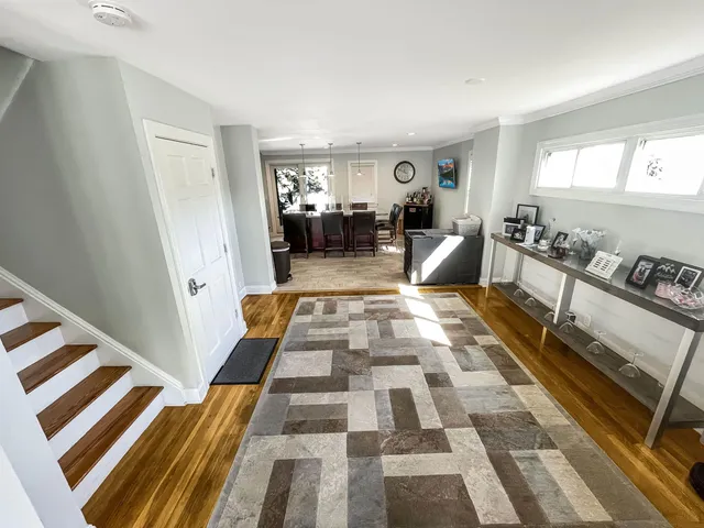 a living room with a couch and a rug