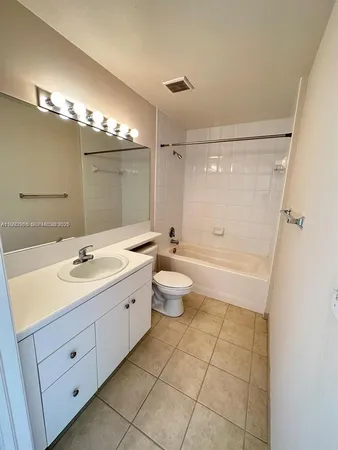 a bathroom with a double vanity sink mirror double and shower