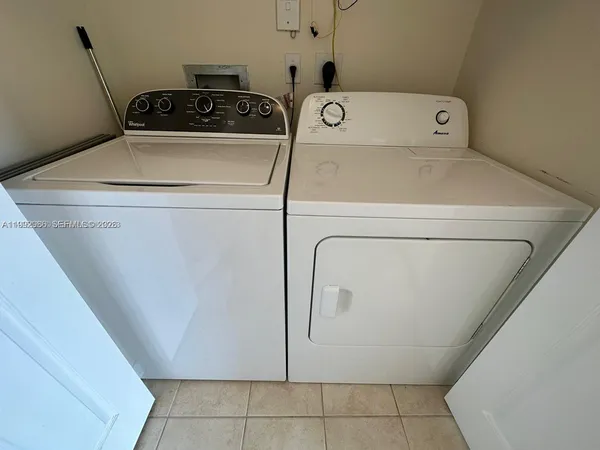 a utility room with dryer and washer