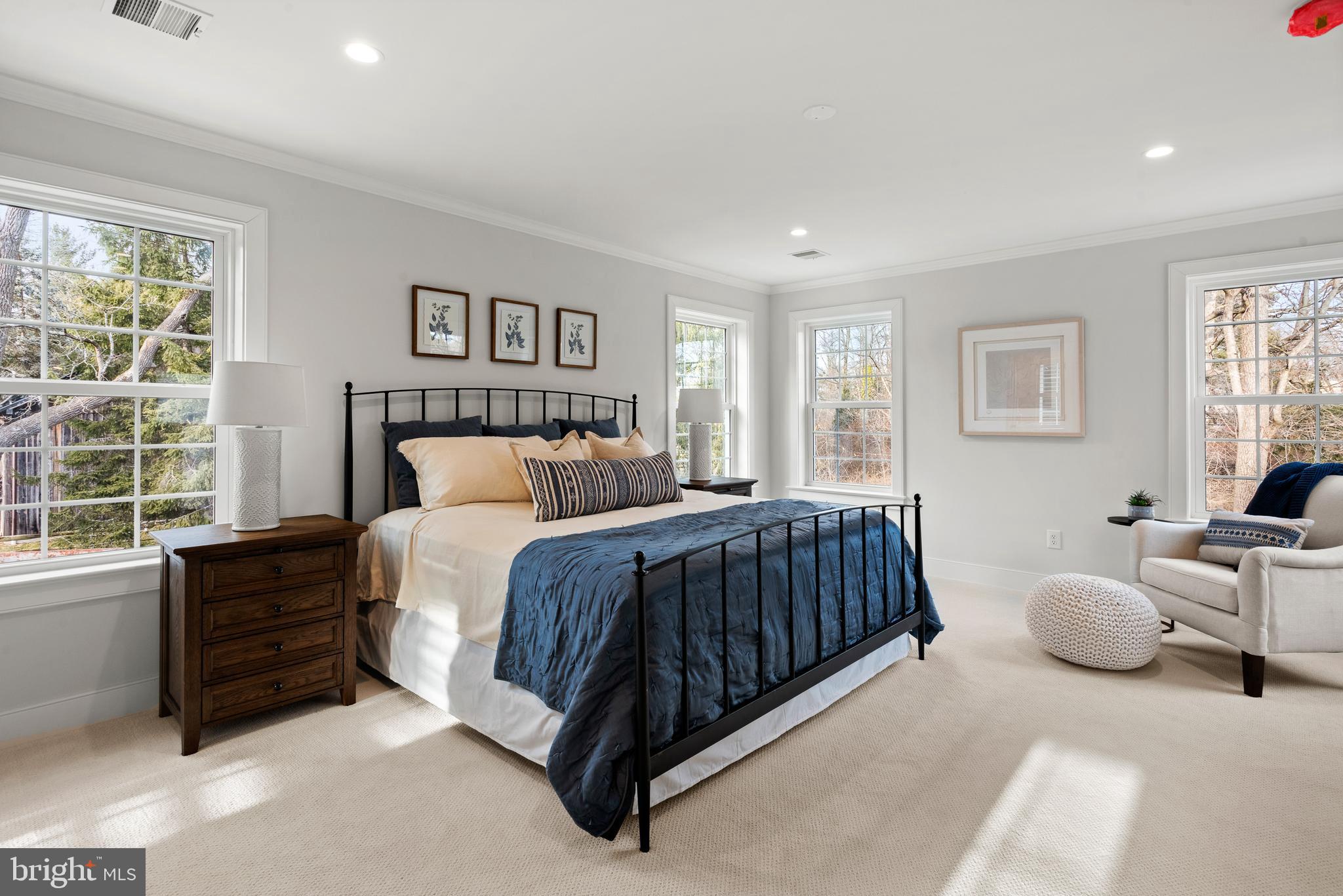 670 Leopard Road Berwyn, PA 19312 - Photo 31 of 52 a spacious bedroom with a bed and glass window