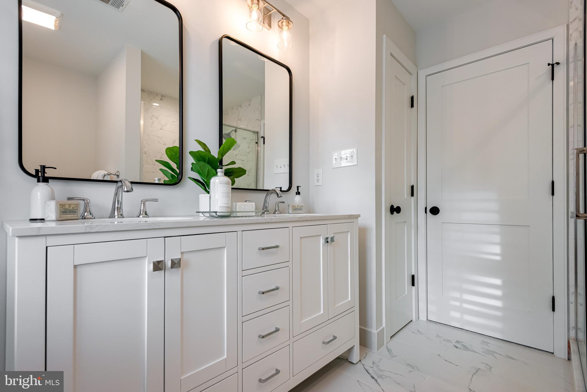 670 Leopard Road Berwyn, PA 19312 - Photo 35 of 52 a bathroom with a sink and a mirror