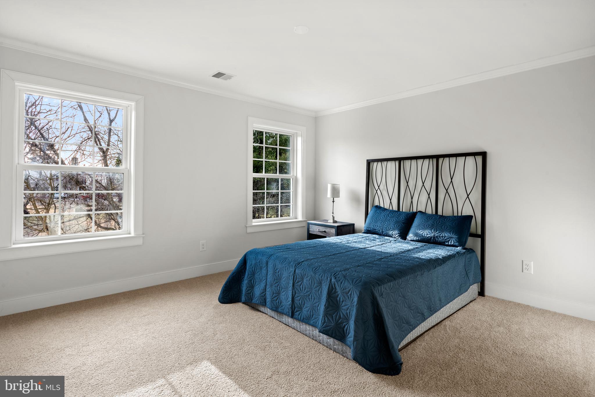 670 Leopard Road Berwyn, PA 19312 - Photo 41 of 52 a bedroom with a bed lamp and window