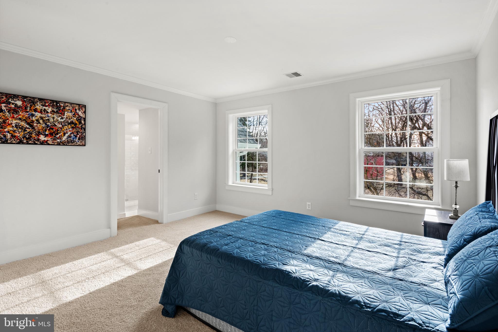 670 Leopard Road Berwyn, PA 19312 - Photo 42 of 52 a bedroom with a bed and a window with chair