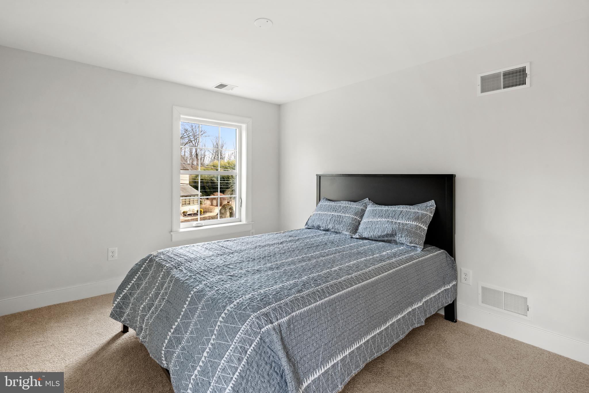 670 Leopard Road Berwyn, PA 19312 - Photo 44 of 52 a bedroom with a bed and a window