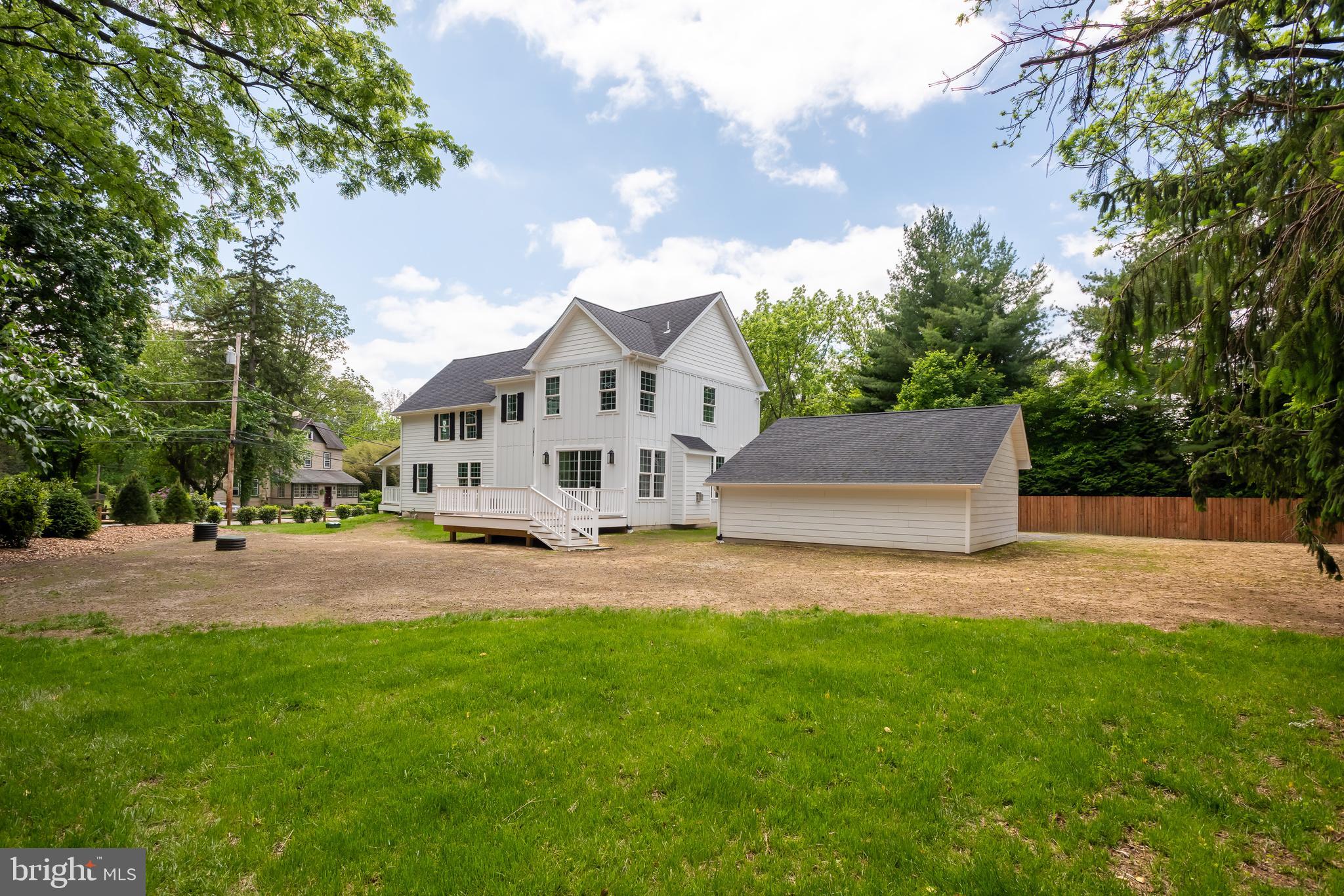 670 Leopard Road Berwyn, PA 19312 - Photo 48 of 52 a front view of a house with a yard and garage