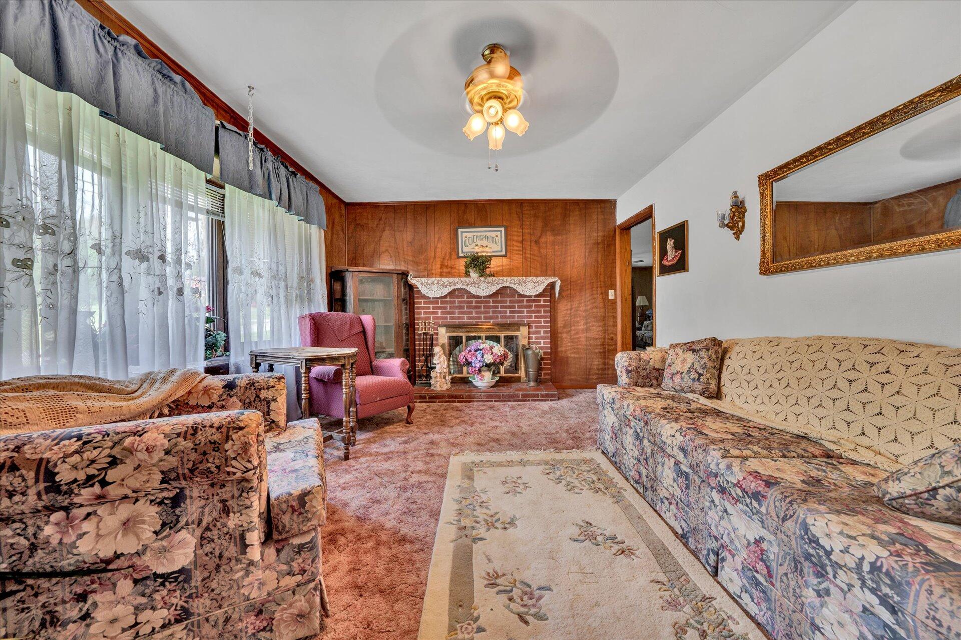 196 Oak Drive Blue Ridge, VA 24064 - Photo 5 of 21 a living room with furniture fireplace and a large window