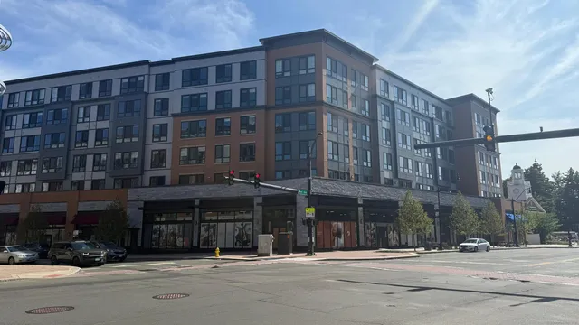 a view of a backyard with sitting area