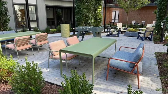 a living room with furniture and a lamp