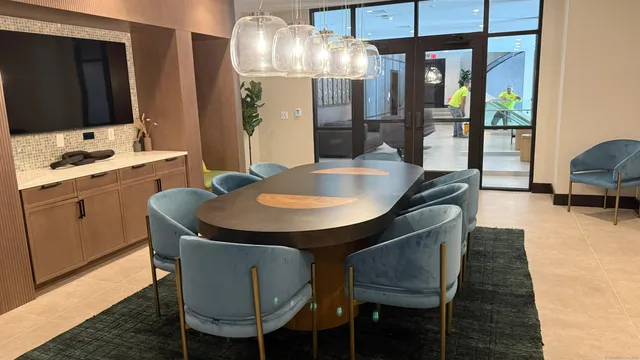 view of a dining room with furniture and wooden floor