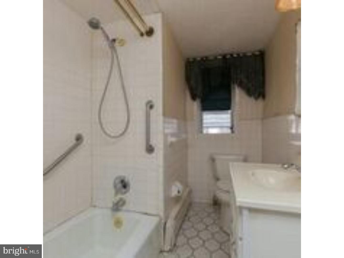 225 Barrington Road Upper Darby, PA 19082 - Photo 13 of 15 a bathroom with a sink toilet and shower