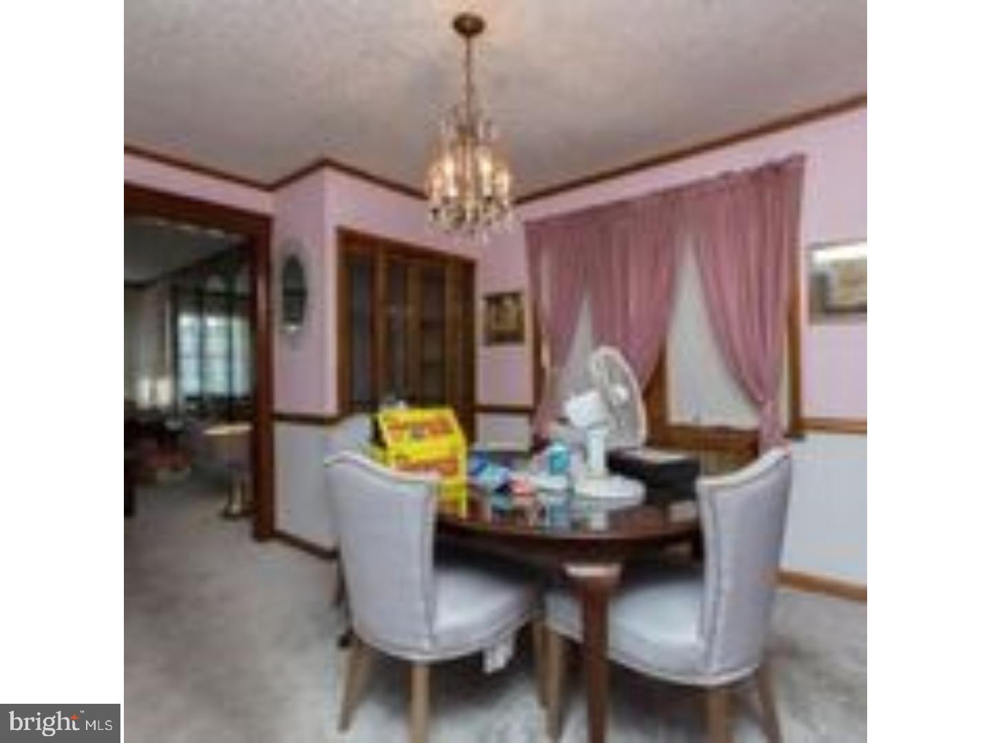 225 Barrington Road Upper Darby, PA 19082 - Photo 6 of 15 a view of a dining room with furniture and chandelier