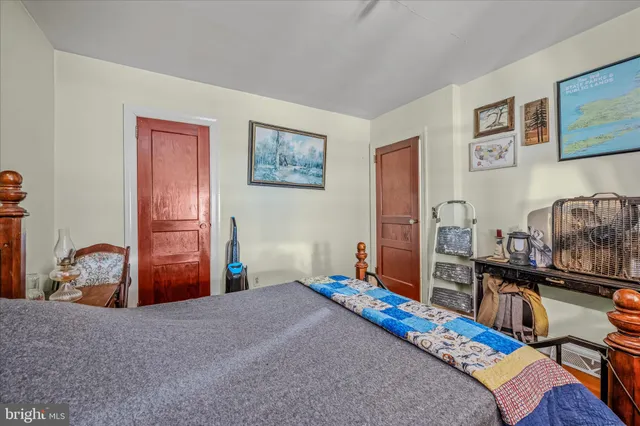 a bedroom with furniture and a window