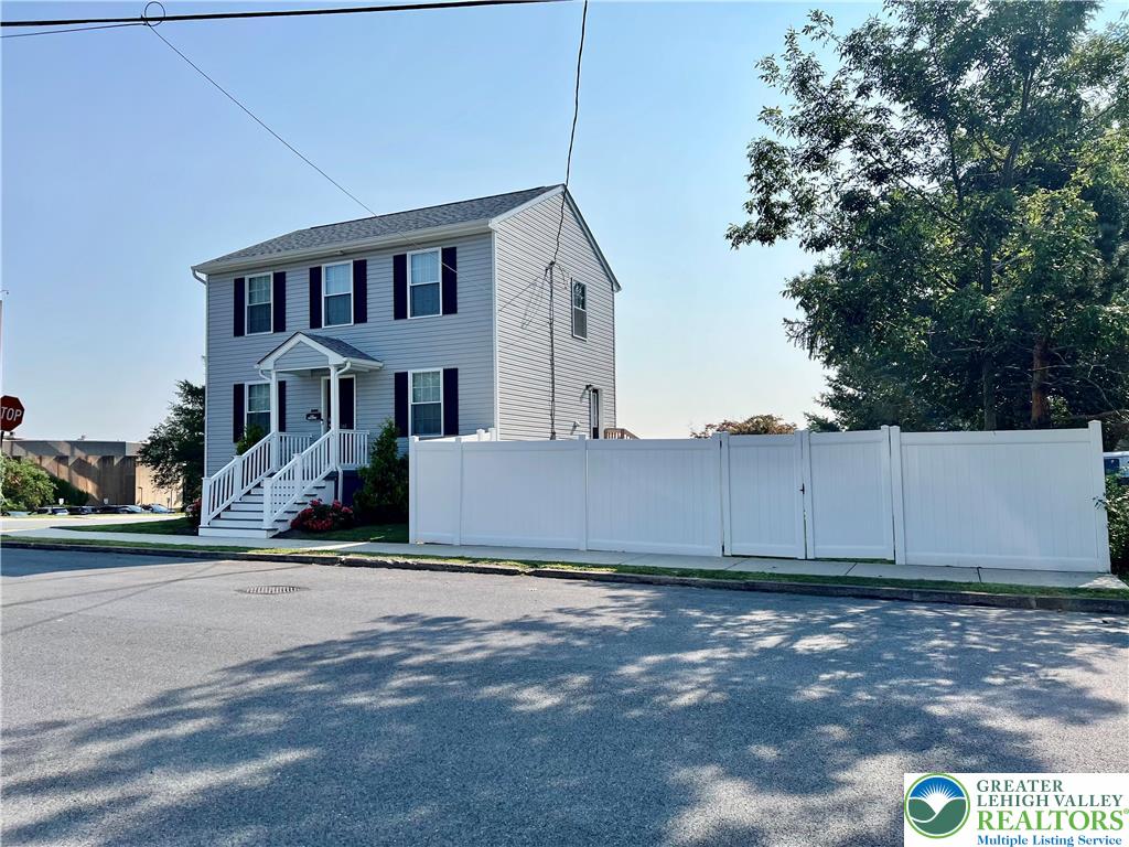 a view of a house with a yard