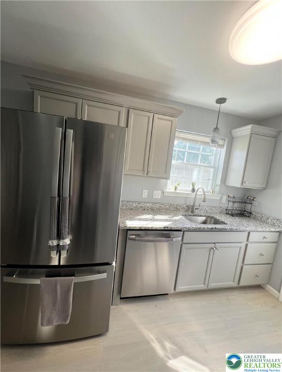 1066 Devonshire Road Allentown, PA 18103 - Photo 8 of 20 a kitchen with stainless steel appliances granite countertop a refrigerator a sink and a stove