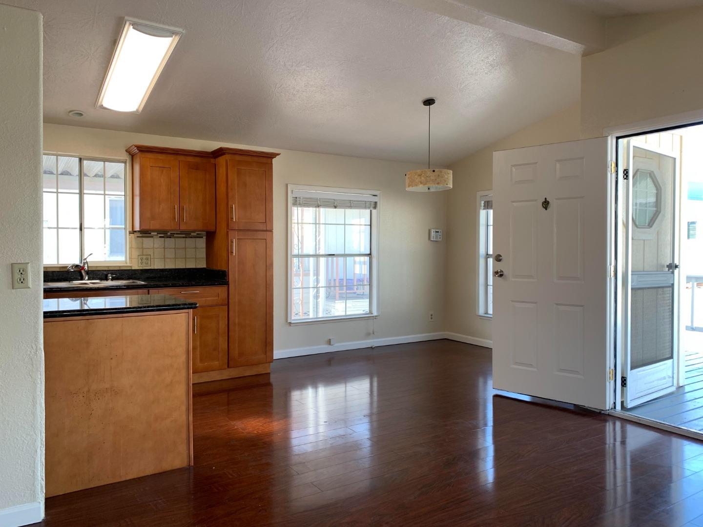 1201 Sycamore Terrace, Unit 87 Sunnyvale, CA 94086 - Photo 11 of 26 a view of empty room with wooden floor and fan