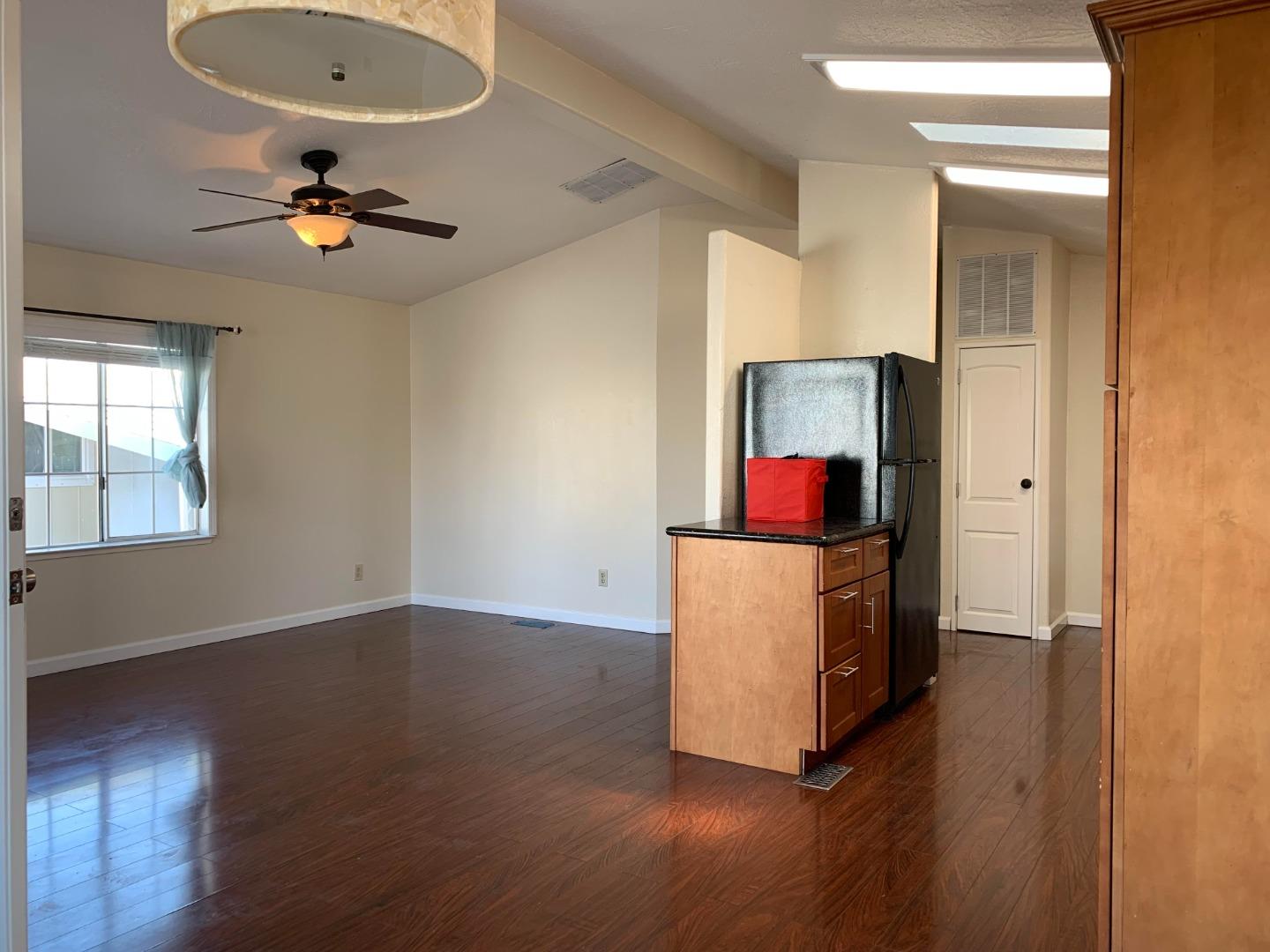 1201 Sycamore Terrace, Unit 87 Sunnyvale, CA 94086 - Photo 15 of 26 a living room with furniture and a wooden floor