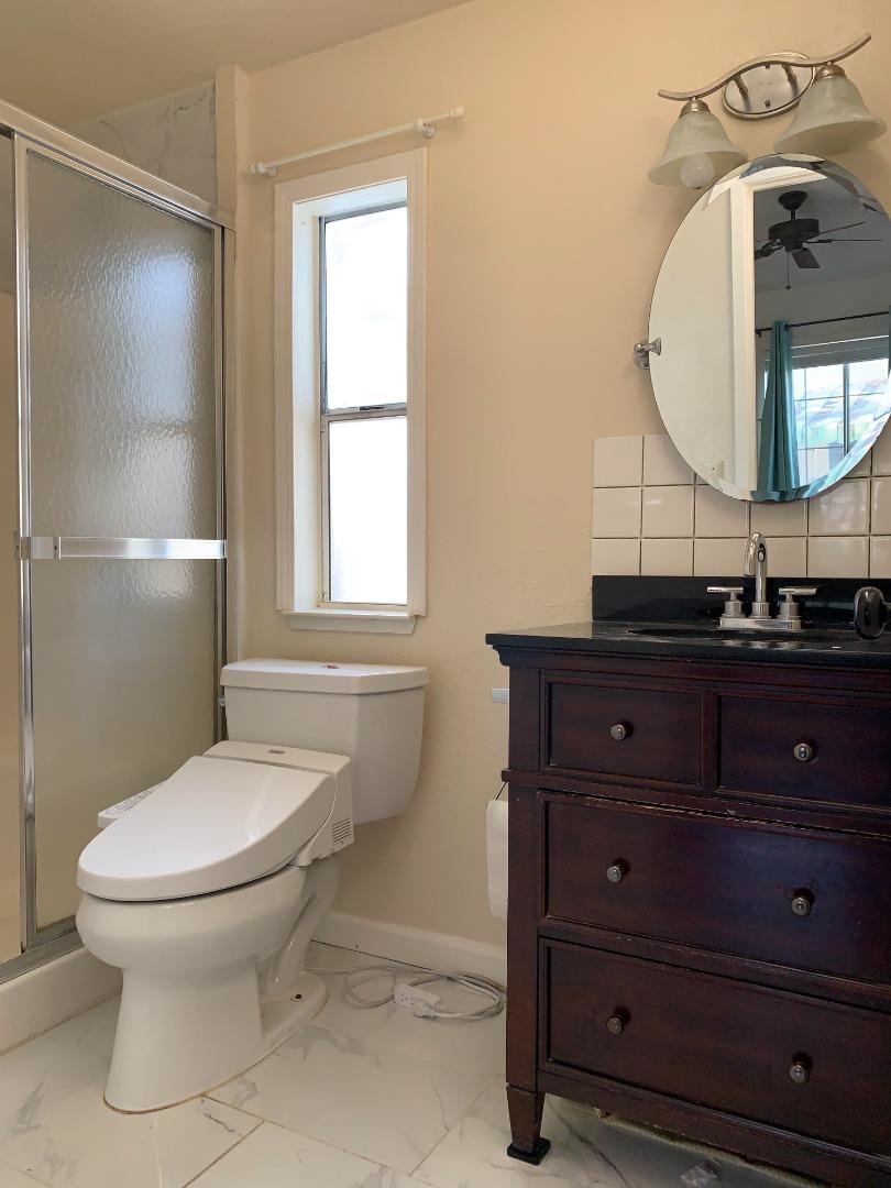 1201 Sycamore Terrace, Unit 87 Sunnyvale, CA 94086 - Photo 20 of 26 a bathroom with a toilet a sink and mirror